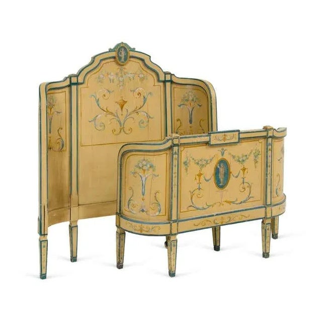 A very rare 20th century handpainted Italian bed. This twin sized bed features an exquisite multicolored Florentine design...