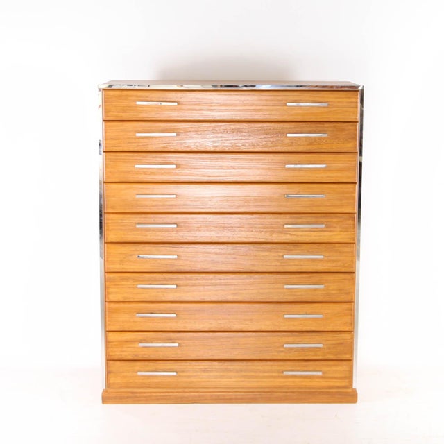 Rare vintage Japanese tall chest of drawers in light wood with chrome handles. Featuring 10 drawers, this chest of...