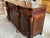 A stunning and substantial signed Maitland-Smith sideboard crafted in richly figured mahogany with elegant Regency and...