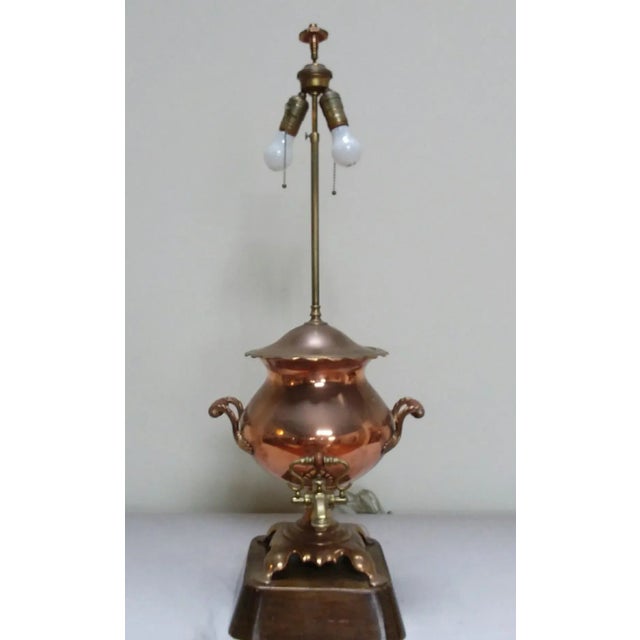 Antique copper Samovar converted to a table lamp. This is a charming piece, with a heavy base which supports the copper urn.