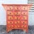 Bring bold Eastern elegance to your space with this vintage Chinese hand-painted red apothecary dresser. The richly...
