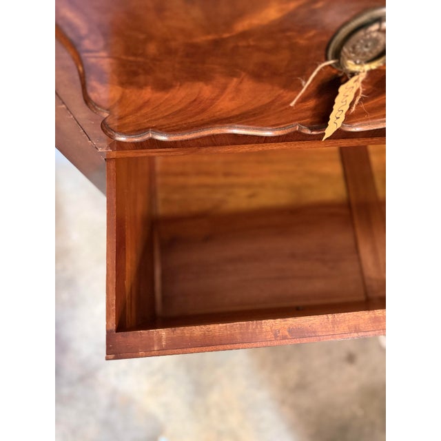 A well-proportioned vintage mahogany chest dating to the early mid 20th century, distinguished by its expressive...