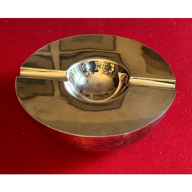 Vintage Art Deco style silverplate orb cigar ashtray. Measures 7 1/8" diameter x 3 1/8" tall. Good condition - light wear...