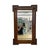 This antique rectangular wall mirror features a darkly stained quartersawn oak frame characterized by tight bobbin or...