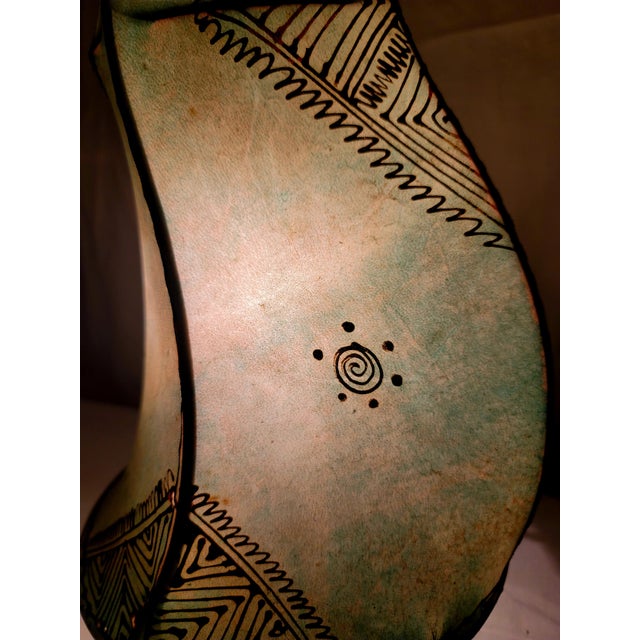 A radiant piece of Moroccan artistry, this handmade henna lamp brings the warmth of the Maghreb into any space. Crafted by...