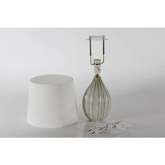 Danish mid-century slim pumpkin shaped fluted table lamp by Laurine ceramics in Holbæk, Denmark. Hand made circa 1960s....