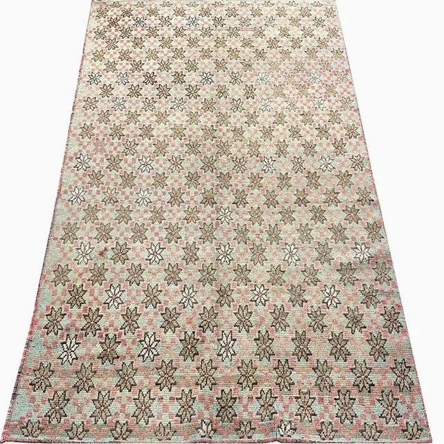 Traditional Vintage Turkish Anatolian Area Rug featuring an allover design in a tan-colored field. Created from 100%...
