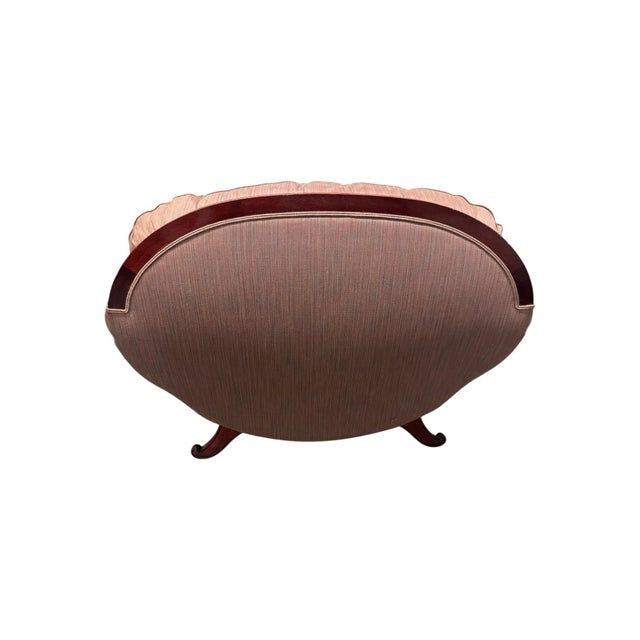 Large, rounded, settee with burlwood trim. Dusty purple heathered, multitone upholstery fabric.