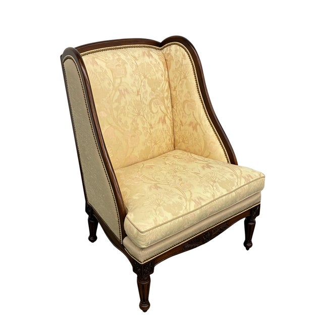 Elegant wingback lounge chair by Hickory Chair Furniture Company, made in Hickory, North Carolina and dating to 2009. The...