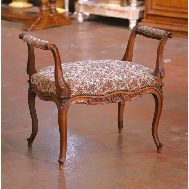 This elegant antique French piano bench was crafted in the mid-century period, circa 1950, and executed in the Louis XV...