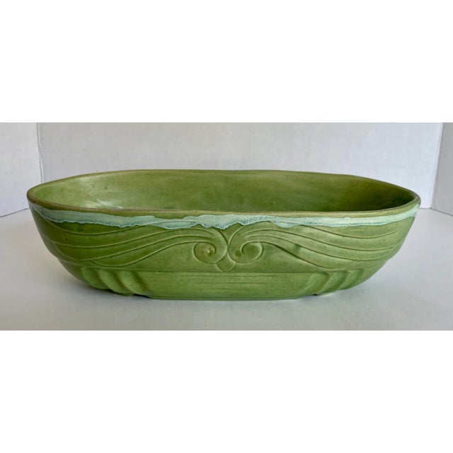 Here is a wonderful, hand-made pottery bowl made by/signed FP in the mid-century. The bowl has an oval shape and fantastic...
