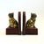 A pair of vintage brass cat bookends. Cats are made of brass attached to wood bases with arched wood backs. Gold brass...