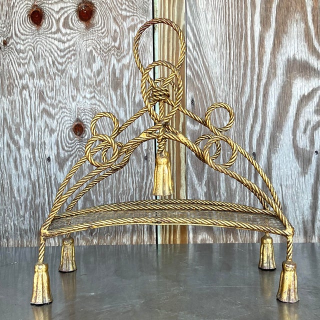 The Vintage Regency Twisted Tassel Newspaper Holder is a charming and decorative piece that reflects the opulent style of...