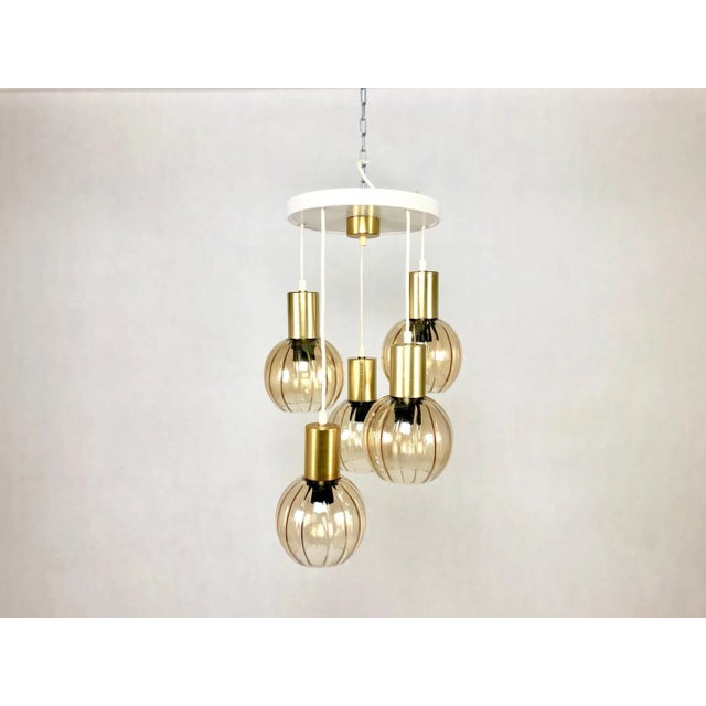 The chandelier has five lampshades, each of which can be adjusted in hanging height. Very good condition. The lampshades...