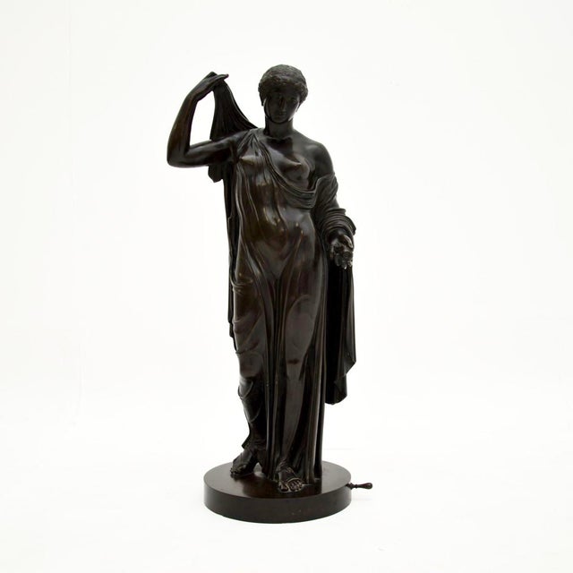 A very impressive & large antique French bronze neoclassical robed lady. We would date this to around the 1880-1900...