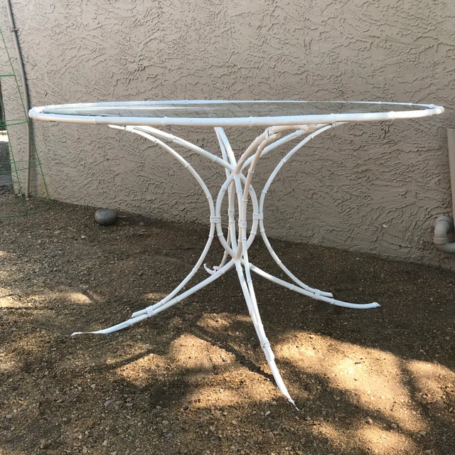 1950s Hollywood Regency, white metal, faux bamboo table with glass top. This chic table would be a wonderful addition on...