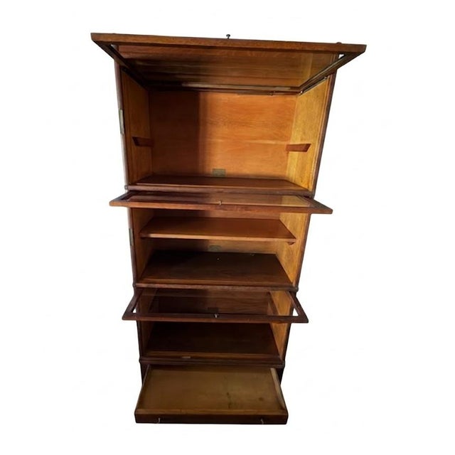 Offered is a stunning, early 20th-century modular sectional bookcase manufactured by the renowned Globe-Wernicke Co. of...