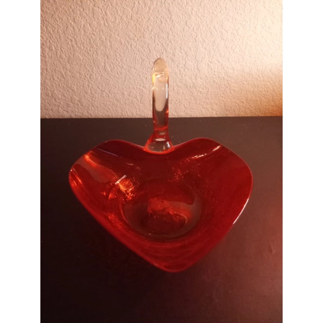 This is a Crackled Red Art Glass 6" Heart Shaped Swan Figurine Catchall Procured at auction