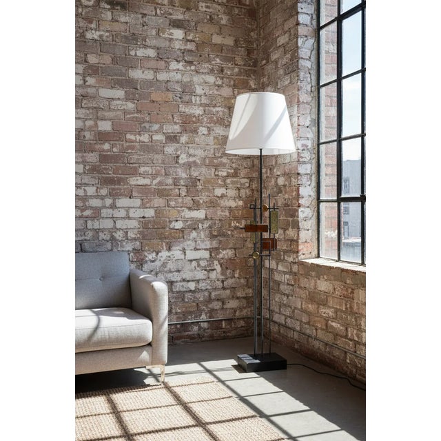 Striking and sculptural floor lamp designed by Svend Aage Holm-Sørensen, Denmark, 1960s. This artistic piece showcases...