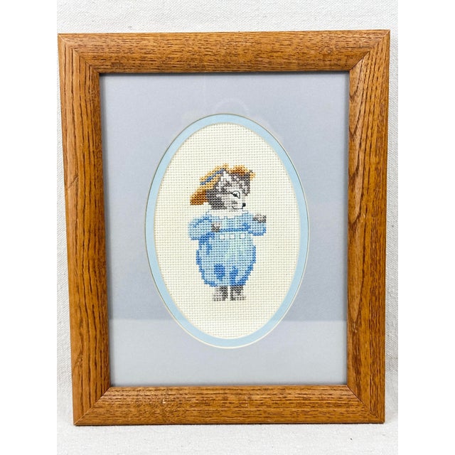 Adorable vintage Beatrix Potter framed cross stitch. Hand made. Features Tom Kitten. Perfect for a nursery or kids room....
