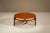 A calm composition where proportion and material take precedence. This round coffee table reflects a mid-century approach...