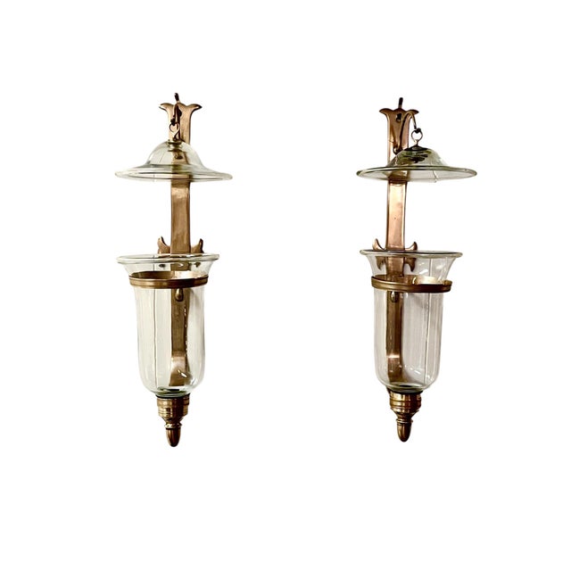 Bring timeless elegance to your walls with this sophisticated pair of vintage brass and glass hurricane wall sconces....