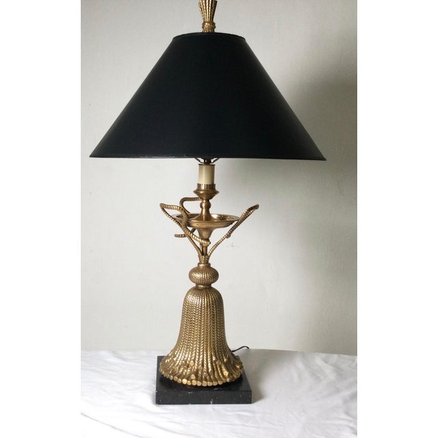 Whimsical cast brass table lamp in an oversized tassel form. The burnished bass finish gives a soft and warm golden brass...