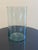 This elegant glass vase features a minimalist cylindrical design that seamlessly blends modern sophistication with...