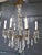 A stunning French cristal 6 branch brass chandelier This is a superb brass chandelier, the centre baluster is covered with...