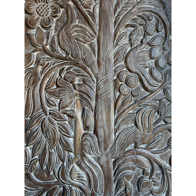 Infuse your space with soulful artistry and timeless charm with this vintage Tree of Life carved barn door panel....
