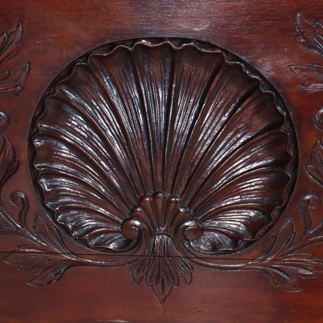 Antique Continental Chippendale mule chest features mahogany construction with carved shell, gadrooned trim and claw &...
