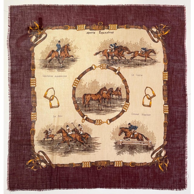 This is a beautiful, lightweight cashmere and silk blend scarf with different equestrian events depicted. It includes...