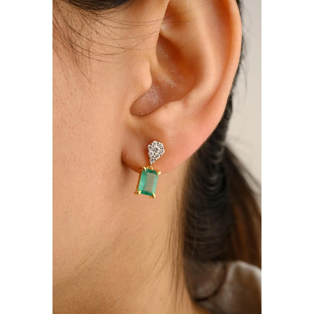 This is part of Chairish’s Fine Jewelry assortment. These 14k solid yellow gold earrings feature octagon-shaped emeralds...