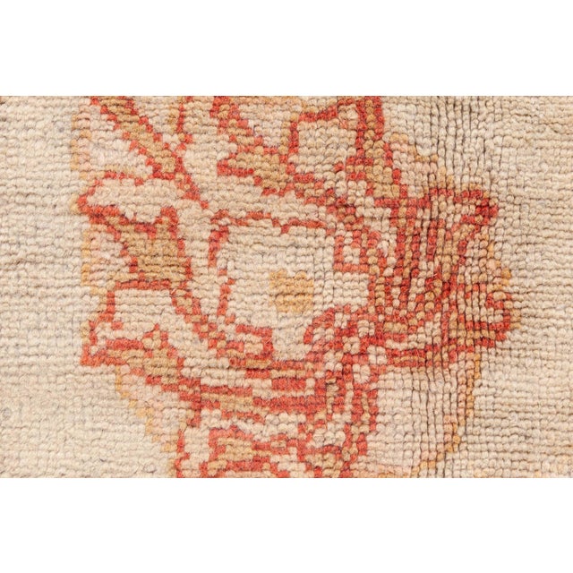 This exquisite antique Turkish Oushak (Ushak) rug, dating from the early 20th century, exemplifies the refined artistry...