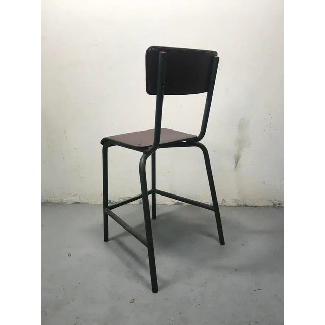 Chair for civil servant in metal with original paint and brown skai seat.