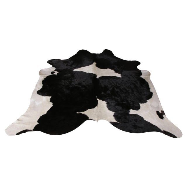 A 7x7 from Rug & Kilim’s line of handmade cowhide rugs. Enjoying a silky, lustrous sheen complementing the positive-...