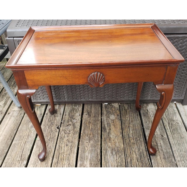 English Mahogany Queen Anne tray top tea table with pull-out slides and supported by graceful cabriole legs ending on pad...