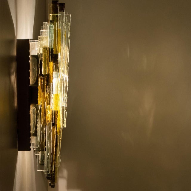 Frosted stained wall light. Manufactured by poliarte, italy in the 1970s. Albano poli founded poliarte in 1968 as an...