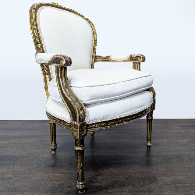 This elegant lounge chair features a comfortable white upholstered cushion and backrest. The frame is made of wood with...