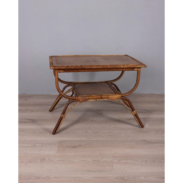 Coffee table with bamboo and wicker structure and wooden shelves, Italian design, 1960s.