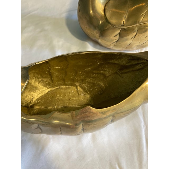 A graceful pair of vintage brass swan figurine boxes, featuring beautifully curved necks and detailed feather etching....