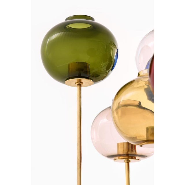 This rare and visually compelling set of 11 candlesticks was designed by swedish lighting master hans-agne jakobsson and...