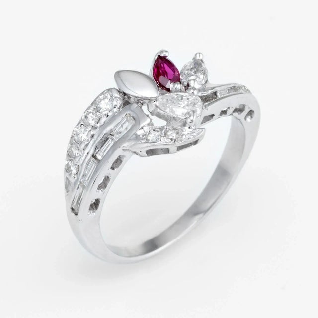 Elegant vintage band, crafted in 14 karat white gold (circa 1980s to 1990s). Mixed cut diamonds (baguette, round...