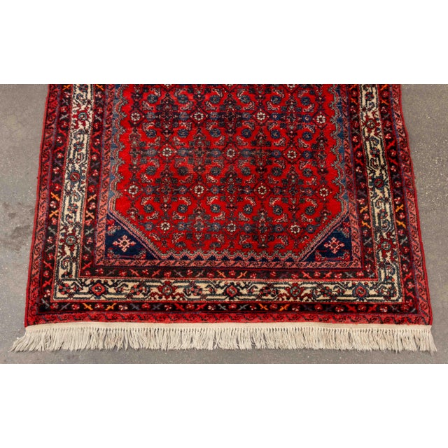 Persian Hamadan Rug, with geometric pattern on a red ground. 11' L x 5' 3.5" W. Provenance: From a Forest Hills Gardens...