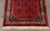 Persian Hamadan Rug, with geometric pattern on a red ground. 11' L x 5' 3.5" W. Provenance: From a Forest Hills Gardens...
