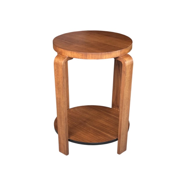 This elegant French 1930s side table is crafted in walnut and has been completely restored and professionally refinished....