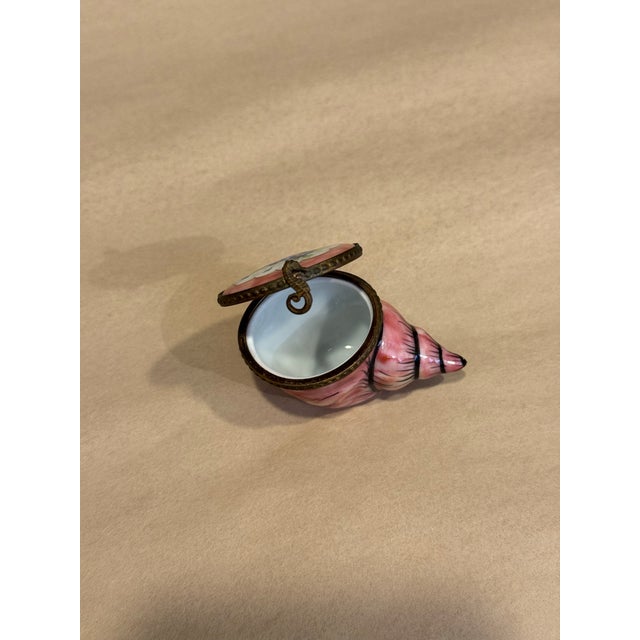 This is a small porcelain Limoges box. It was curated and hand painted in France. It has a hand botanical painted...