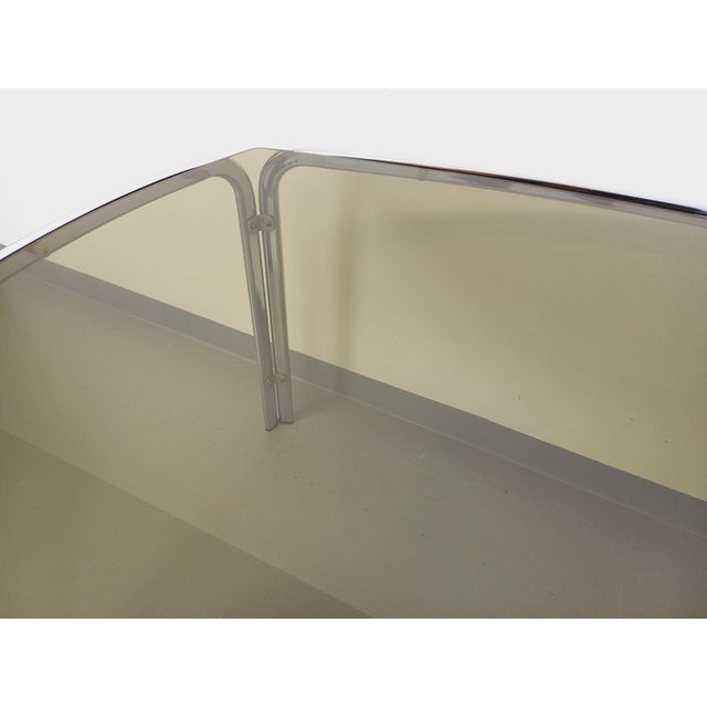 Vintage dining table from the 70s, Space Age style, rectangular curved smoked glass top, designer chrome metal leg, very...