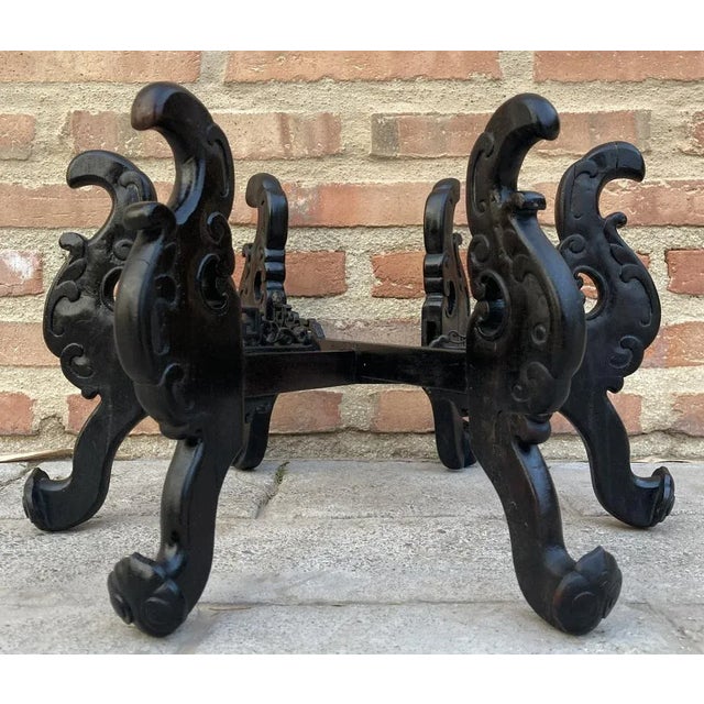 A round shaped finely carved wooden display stand, China, mid-20th century. The circular display stand carved from rare...