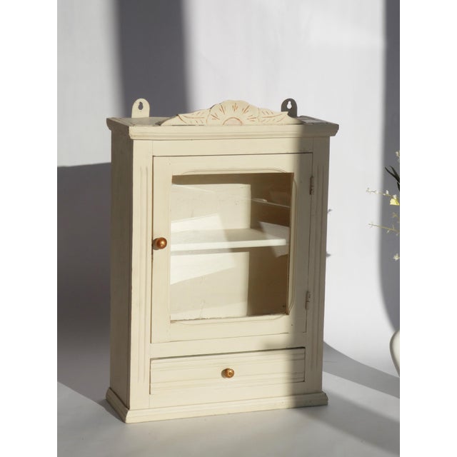 Vintage Rustic Beige Apothecary Cabinet with Glass Door, Carved Floral Ornaments, Shelf and Drawer For Sale - Image 4 of 10